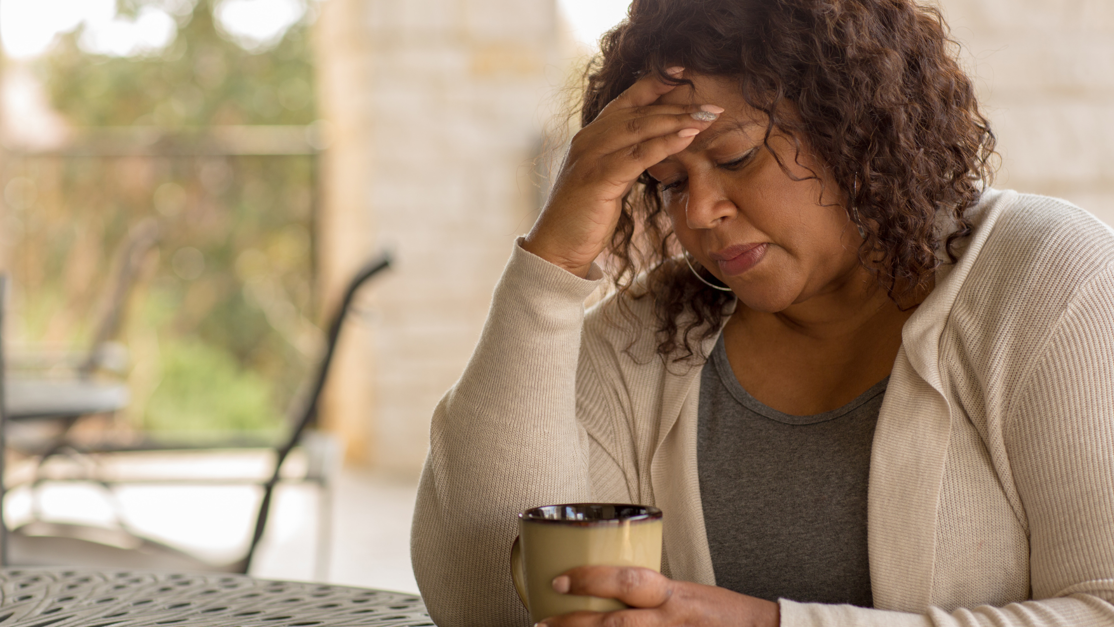 woman with headache suffering from menopause
